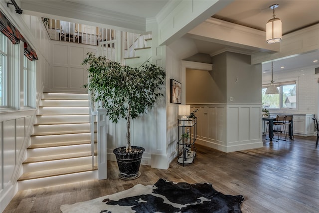 3070 River Lakes Dr, Whitefish, MT 59937 - stairway with a decorative wall, wood finished floors, crown molding, and wainscoting