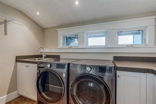 3070 River Lakes Dr, Whitefish, MT 59937 - laundry area featuring washer and dryer, plenty of natural light, cabinet space, wood finished floors, and recessed lighting