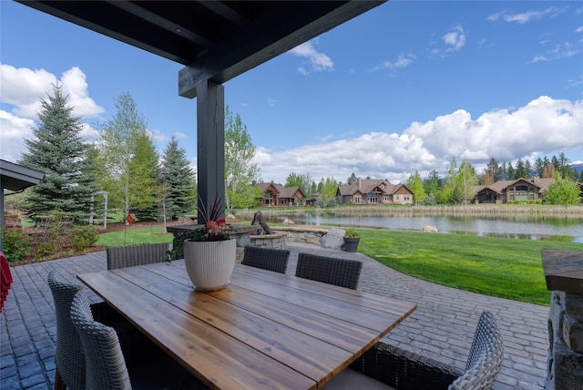 3070 River Lakes Dr, Whitefish, MT 59937 - view of patio featuring a water view, outdoor dining area, and a residential view