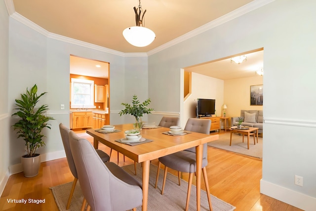 6021 Hobson Ln, Missoula, MT 59803 - dining room with ornamental molding, light wood-style flooring, baseboards, and a chandelier