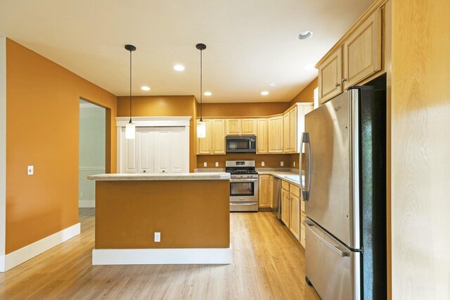 6021 Hobson Ln, Missoula, MT 59803 - kitchen with appliances with stainless steel finishes, light wood-style flooring, light brown cabinets, light countertops, and recessed lighting