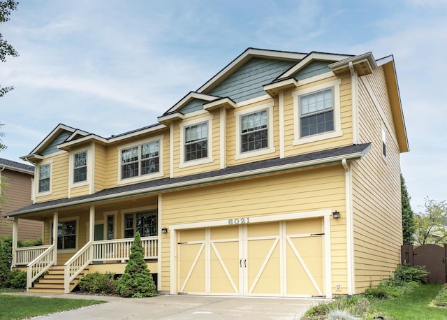 6021 Hobson Ln, Missoula, MT 59803 - craftsman-style home featuring a garage, a porch, and concrete driveway