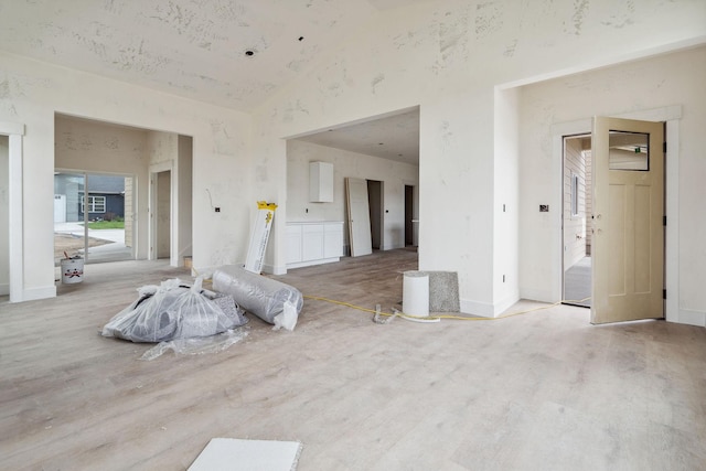 623 Holstein Way, Kalispell, MT 59901 - unfurnished living room featuring high vaulted ceiling and wood finished floors