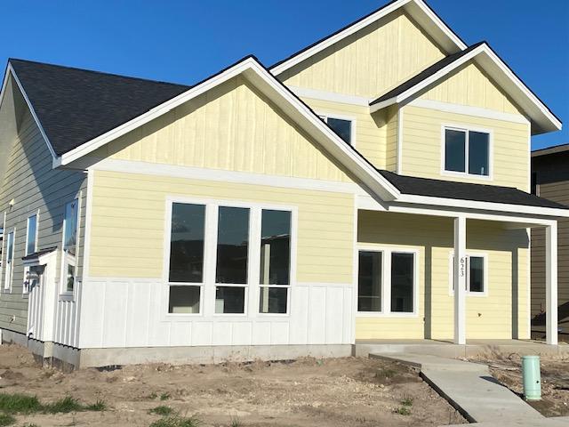 623 Holstein Way, Kalispell, MT 59901 - rear view of property featuring board and batten siding and covered porch