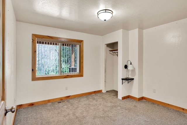 26 Two Rivers Rd, Saint Regis, MT 59866 - unfurnished bedroom with carpet flooring, baseboards, and a closet