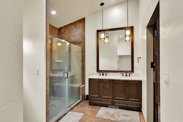 26 Two Rivers Rd, Saint Regis, MT 59866 - full bathroom featuring a stall shower, double vanity, a textured wall, and lofted ceiling