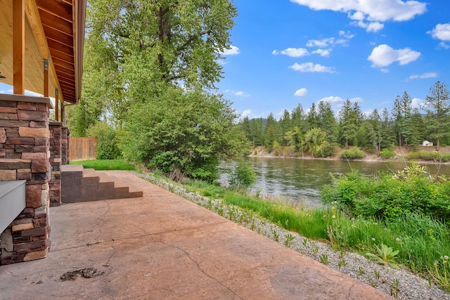 26 Two Rivers Rd, Saint Regis, MT 59866 - view of patio featuring a water view and a forest view