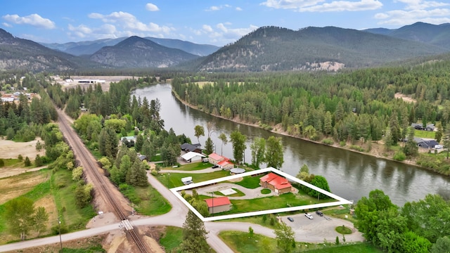 26 Two Rivers Rd, Saint Regis, MT 59866 - aerial view of property and surrounding area with a water and mountain view, property parcel outlined, and a forest