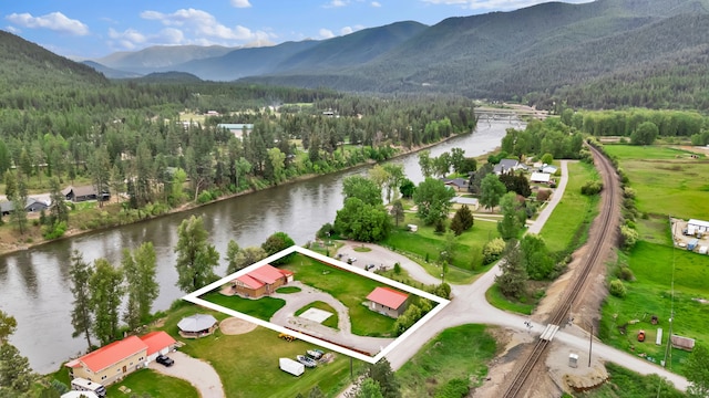 26 Two Rivers Rd, Saint Regis, MT 59866 - view of property location with property boundaries highlighted, a water and mountain view, and a heavily wooded area