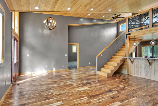 26 Two Rivers Rd, Saint Regis, MT 59866 - unfurnished living room featuring wood finished floors, wood ceiling, stairway, a towering ceiling, and recessed lighting