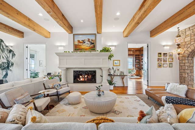 2761 Contour Rd, Missoula, MT 59802 - living room featuring wood finished floors, a lit fireplace, healthy amount of natural light, beamed ceiling, and recessed lighting