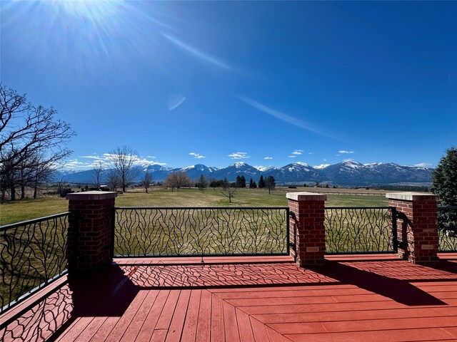 444 Windwalker Trl, Stevensville, MT 59870 - wooden deck with a mountain view and a view of rural / pastoral area