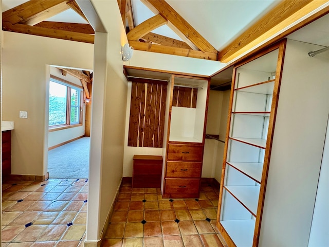 444 Windwalker Trl, Stevensville, MT 59870 - walk in closet featuring tile patterned flooring and vaulted ceiling