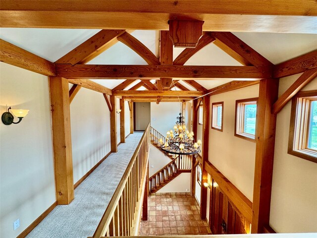 444 Windwalker Trl, Stevensville, MT 59870 - corridor featuring a chandelier, an upstairs landing, and baseboards