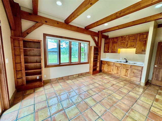 444 Windwalker Trl, Stevensville, MT 59870 - kitchen featuring a sink, light countertops, beam ceiling, recessed lighting, and baseboards
