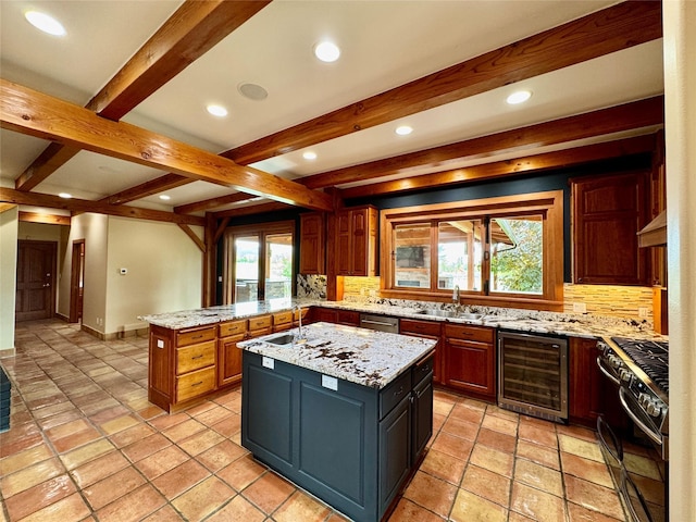 444 Windwalker Trl, Stevensville, MT 59870 - kitchen with wine cooler, gas stove, backsplash, beam ceiling, and a peninsula