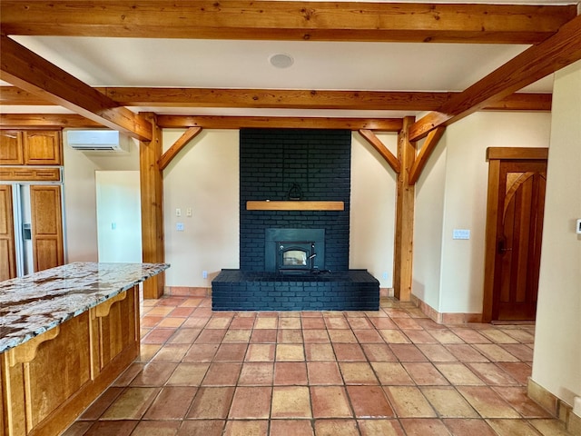 444 Windwalker Trl, Stevensville, MT 59870 - unfurnished living room featuring a wall unit AC, beamed ceiling, baseboards, and arched walkways