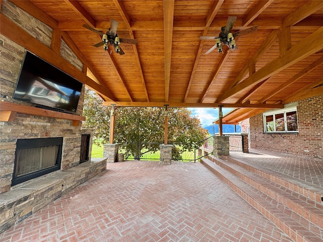 444 Windwalker Trl, Stevensville, MT 59870 - view of patio / terrace featuring an outdoor stone fireplace