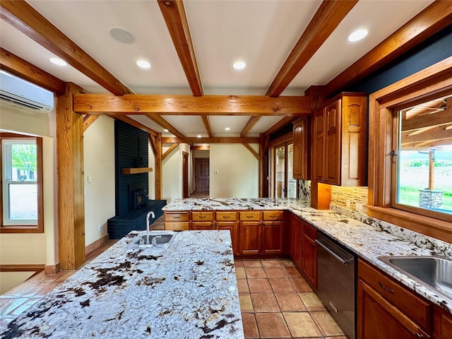 444 Windwalker Trl, Stevensville, MT 59870 - kitchen with dishwasher, a sink, a brick fireplace, a wall mounted AC, and beamed ceiling
