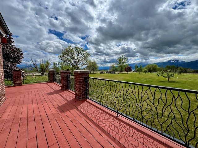 444 Windwalker Trl, Stevensville, MT 59870 - wooden terrace featuring a mountain view and a lawn