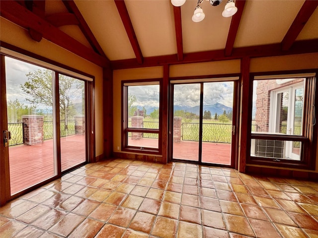 444 Windwalker Trl, Stevensville, MT 59870 - unfurnished sunroom featuring a chandelier