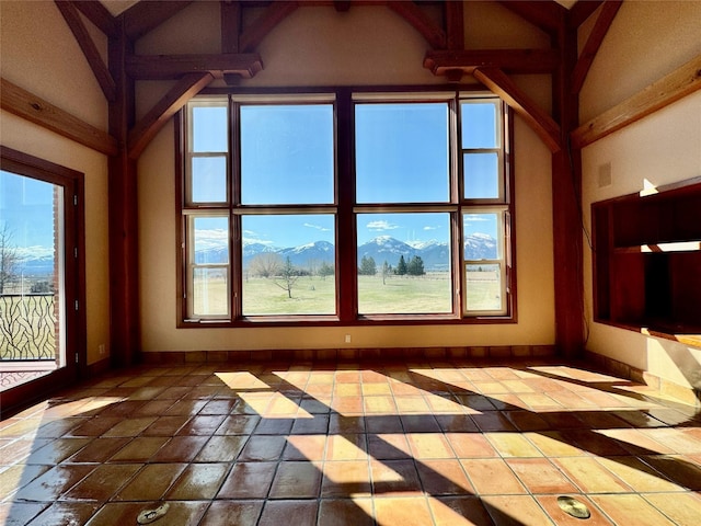 444 Windwalker Trl, Stevensville, MT 59870 - unfurnished living room featuring baseboards and healthy amount of natural light