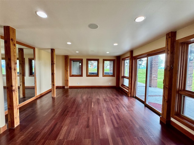 444 Windwalker Trl, Stevensville, MT 59870 - unfurnished living room featuring dark wood-type flooring, recessed lighting, and baseboards