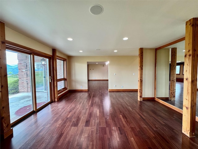 444 Windwalker Trl, Stevensville, MT 59870 - unfurnished room with dark wood finished floors, baseboards, and recessed lighting