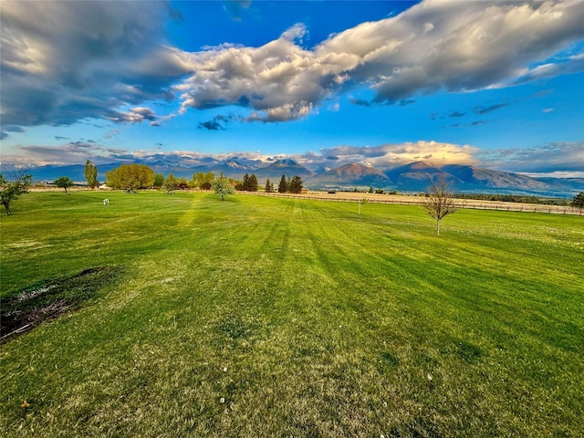 444 Windwalker Trl, Stevensville, MT 59870 - view of green lawn with a rural view and a mountain view