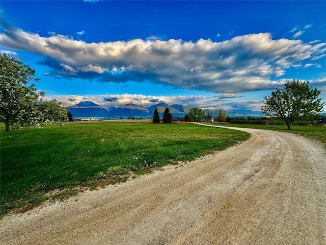 444 Windwalker Trl, Stevensville, MT 59870 - view of dirt / gravel road with a mountain view and a view of rural / pastoral area