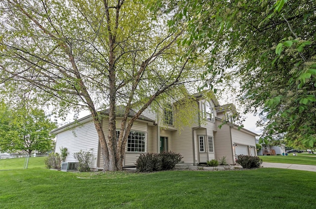 5040 Jordan Ct, Missoula, MT 59803 - view of front facade with a front lawn, driveway, an attached garage, and cooling unit
