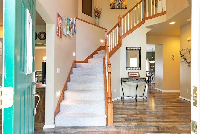 5040 Jordan Ct, Missoula, MT 59803 - stairs featuring wood finished floors, baseboards, and a high ceiling