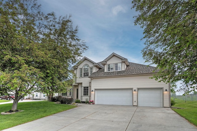 5040 Jordan Ct, Missoula, MT 59803 - traditional-style home featuring concrete driveway, an attached garage, a front lawn, and roof with shingles