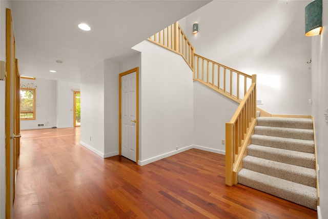 259 Eagle Bend Dr, Bigfork, MT 59911 - stairs with wood finished floors, recessed lighting, and baseboards