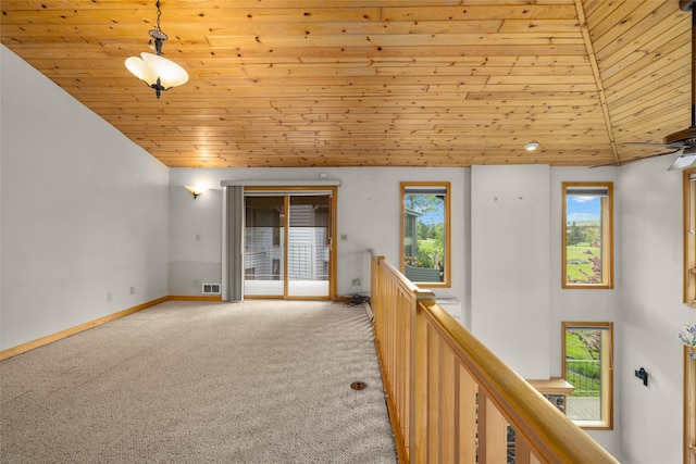 259 Eagle Bend Dr, Bigfork, MT 59911 - unfurnished room with wooden ceiling, carpet flooring, and baseboards