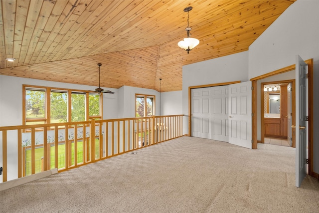 259 Eagle Bend Dr, Bigfork, MT 59911 - unfurnished room with ceiling fan, carpet, wood ceiling, and high vaulted ceiling