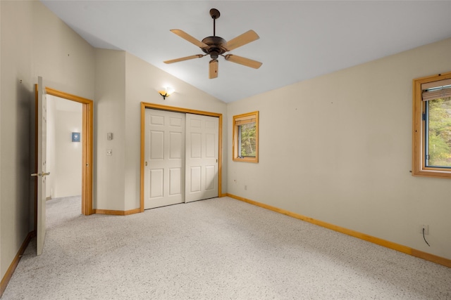 259 Eagle Bend Dr, Bigfork, MT 59911 - unfurnished bedroom featuring lofted ceiling, a closet, baseboards, and ceiling fan