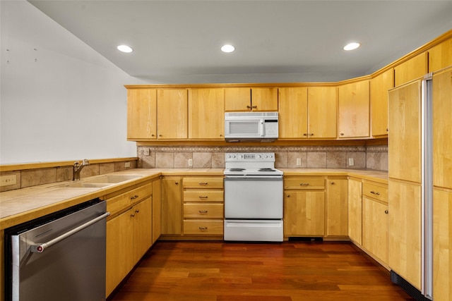 259 Eagle Bend Dr, Bigfork, MT 59911 - kitchen featuring white appliances, dark wood-type flooring, light brown cabinetry, a sink, and tasteful backsplash