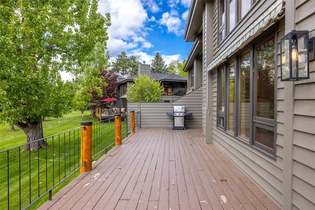259 Eagle Bend Dr, Bigfork, MT 59911 - deck featuring area for grilling and a lawn