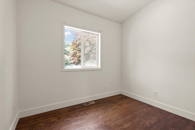 515 W Oregon St, Kalispell, MT 59901 - empty room featuring baseboards and dark wood-type flooring