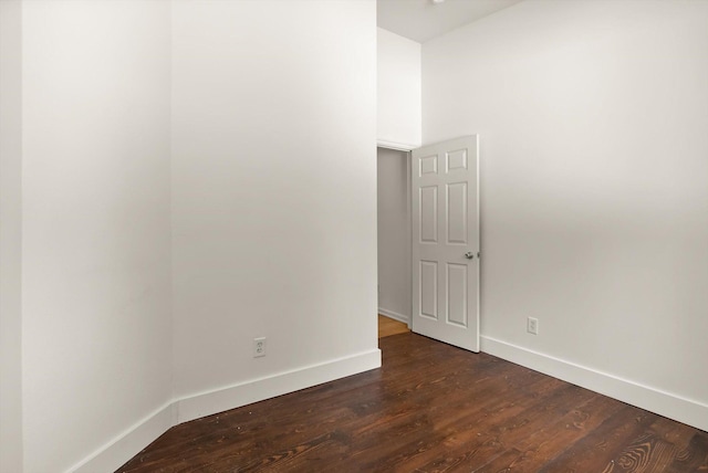 515 W Oregon St, Kalispell, MT 59901 - empty room featuring baseboards, dark wood-type flooring, and high vaulted ceiling