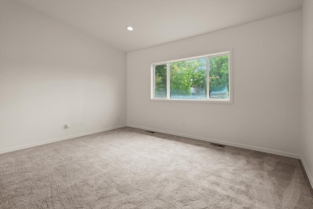 515 W Oregon St, Kalispell, MT 59901 - carpeted empty room featuring baseboards and recessed lighting