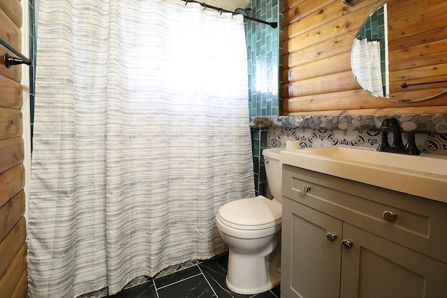 323 B St, Dixon, MT 59831 - full bathroom with vanity, rustic walls, toilet, and a shower with shower curtain