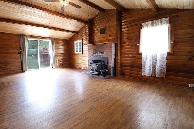 323 B St, Dixon, MT 59831 - unfurnished living room featuring a wood stove, hardwood / wood-style floors, ceiling fan, and wooden ceiling
