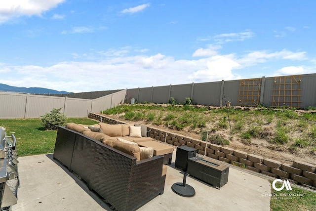 339 Elouise Cobell St, Helena, MT 59601 - fenced backyard featuring an outdoor living space, a patio, and a mountain view