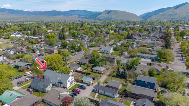 1935 S 12th St W, Missoula, MT 59801 - aerial view of property's location with a mountain backdrop and nearby suburban area