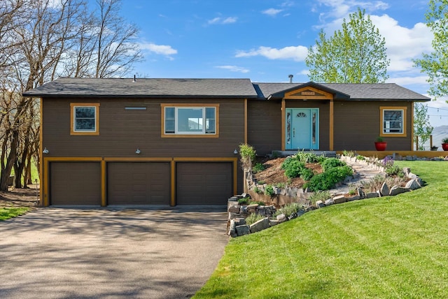 51943 Kuntz Ln, Charlo, MT 59824 - view of front facade featuring a garage, driveway, and a front yard