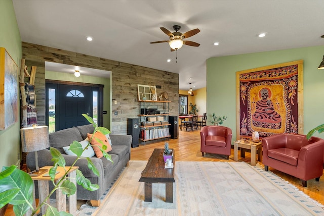 51943 Kuntz Ln, Charlo, MT 59824 - living room featuring a ceiling fan, plenty of natural light, recessed lighting, wood finished floors, and an accent wall