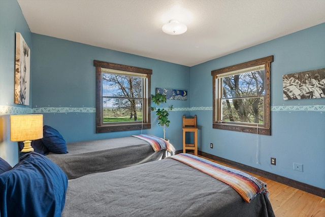 51943 Kuntz Ln, Charlo, MT 59824 - bedroom with wood finished floors and baseboards