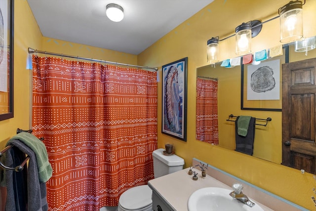 51943 Kuntz Ln, Charlo, MT 59824 - full bath featuring toilet, vanity, and a shower with shower curtain
